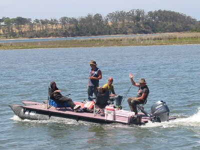 A pontoon boat designed and built by a self confessed Pirate