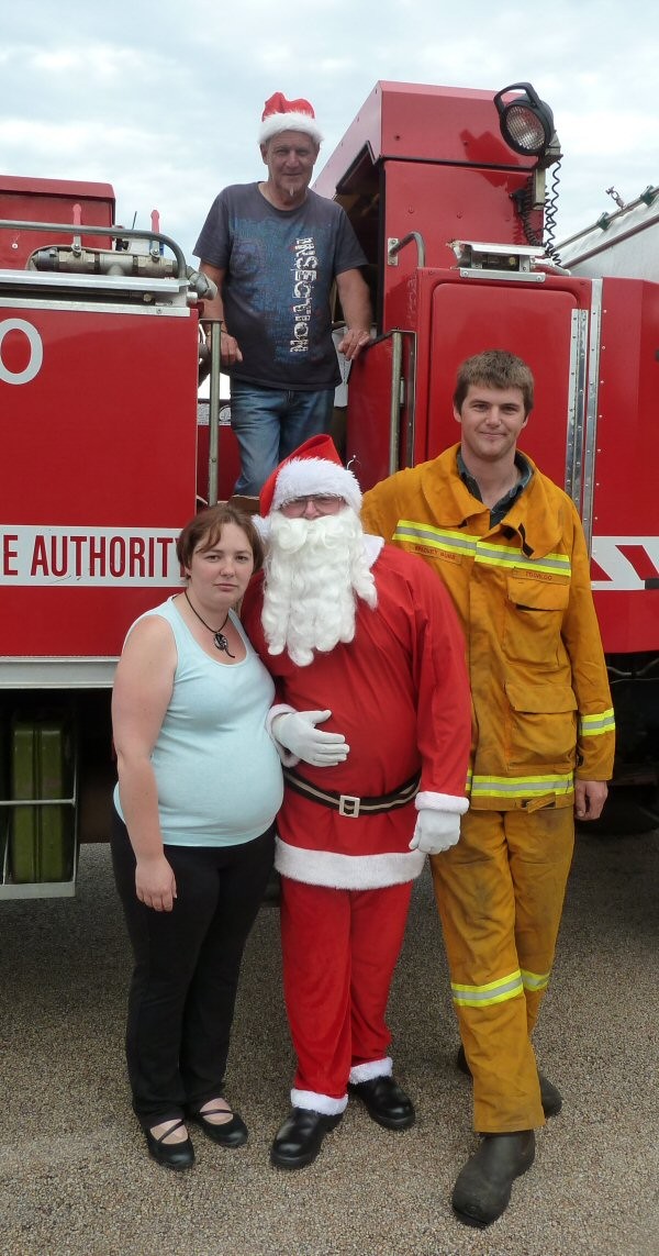 Santa with hjs loyal helpers at Lake Tyers Beach