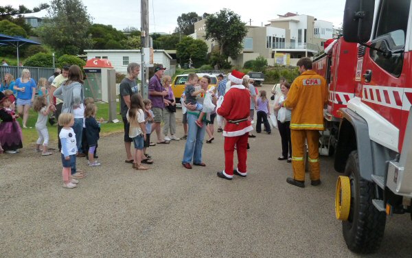 Santa creating goodwill and happiness at Lake Tyers Beach
